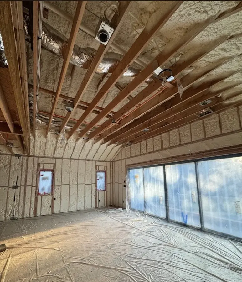 Interior walls and ceiling insulated with spray foam during new construction in Le Mars